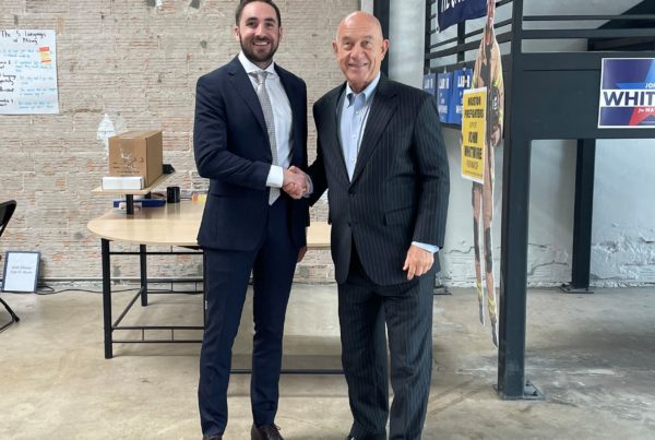 President Brandon Hopkins shakes hands with John Whitmire running for Houston Mayor